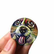 Load image into Gallery viewer, A circle wood pendant featuring a portrait of a corgi in all the colours of the rainbow. Available as either a keepsake, fridge magnet, or a necklace
