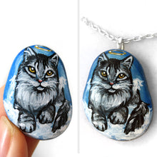 Load image into Gallery viewer, art of a silver gray maine coon cat as an angel, is hand painted on a river rock, and is available as either a keepsake, magnet or a pendant necklace
