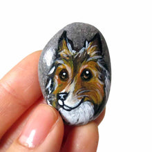 Load image into Gallery viewer, a beach rock painted with dog art: a portrait of a rough collie, available as either a keepsake, fridge magnet, or a pendant necklace
