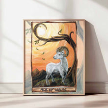 Load image into Gallery viewer, an art print featuring the ace of wands card from the animism tarot: a white ram, standing on the top of a mountain, under a twisted tree and an orange sky.
