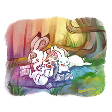 Load image into Gallery viewer, An art print featuring characters from Rainbow of Crazy Comics: three rabbits enjoy their books while sharing a blanket near a large tree. A fence is in the distance. An English spot rabbit reads a novel. A mini lop rabbit listens to an audiobook, and a white rabbit reads a manga.
