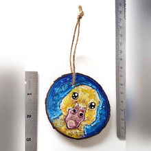Load image into Gallery viewer, a wood ornament hand painted with a yellow baby duck against a royal blue background
