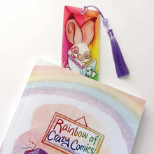 Load image into Gallery viewer, The rabbit bookmark peaking out of Rainbow of Crazy Comics, Volume One
