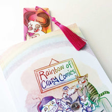 Load image into Gallery viewer, The rabbit bookmark peaking out of Rainbow of Crazy Comics, Volume One
