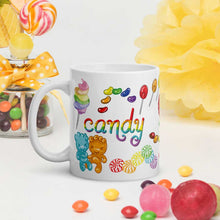 Load image into Gallery viewer, The Candy Lovers Mug, 11 oz size, is printed with 10 different types of candy in all the colours of the rainbow
