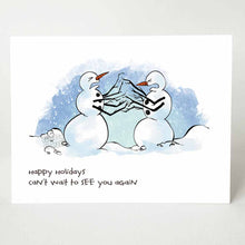 Load image into Gallery viewer, greeting card with an illustration of two snowmen facing each other, both with pained and angry expressions on their faces. multiple branches are in place of their arms, making it appearing as if they're fighting each other. the card reads "happy holidays. can't wait to see you again"
