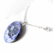 Load image into Gallery viewer, Small lightweight wood disc, hand painted with a portrait of a chinchilla as an angel, with halo and wings, sitting on clouds against a purple sky
