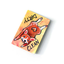 Load image into Gallery viewer, yellow and orange wood magnet, hand painted with a corgi with a tail in a heart shape, tongue out, doing a sploot. near the top of the dog's head is the word CLEAN. written upside down next to the dog's butt is the word DIRTY
