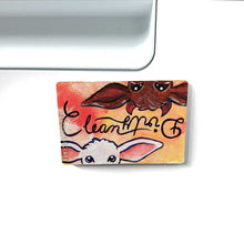 Load image into Gallery viewer, yellow/red wood magnet, hand painted, bottom features a white goat, with the word "clean" above them, at the top, upside down is a brown goat with little red horns with the word "Dirty" above them
