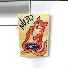 Load image into Gallery viewer, yellow wood magnet, hand painted with an orange cat with its tongue out. near the top of the cat's head is the word CLEAN. a black bar covers the cat's crotch and says the word DIRTY. around the bar, the cat's body is pixelated
