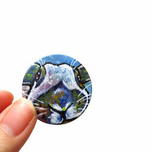 Load image into Gallery viewer, a small round wood disc, hand painted with a portrait of an English Spot rabbit, face up close, painted in rainbow colours. it's available as a keepsake or pendant necklace
