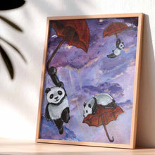 Load image into Gallery viewer, art print featuring three giant panda bears flying through a purple sky, each holding on to a red umbrella
