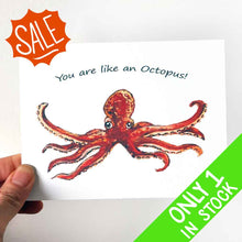 Load image into Gallery viewer, a greeting card featuring art of a red octopus with two tentacles stretched out. The card reads, "I love you THIS much!"
