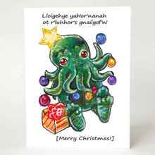 Load image into Gallery viewer, a greeting card with an illustration of a Cthulhu dressed as a Christmas tree. The card reads,  "Lloigehye yah'or'nanah ot r'luhhor's gnaiigof'n!" above and "[Merry Christmas!]" below
