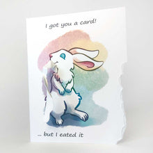 Load image into Gallery viewer, a greeting card with art of a white rabbit standing on hind legs. a piece from the of the right side of card has been ripped off and hangs from the rabbit's mouth. "I got you a card! ... but I eated it"
