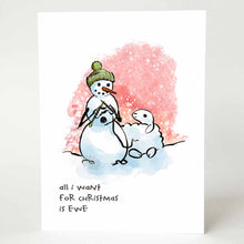 Load image into Gallery viewer, greeting card with an illustration of a smiling snowman wearing a green winter hat,  holding knitting needles as it knits from a smiling snow sheep. on the bottom, the card reads, "all i want for Christmas is ewe"
