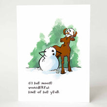 Load image into Gallery viewer, a greeting card that reads, "it's the moose wonderful time of the year" and has an illustration of a snowman's headless body, arms on its hips. the snowman's head is on top of a moose's head, held up by the moose's antlers. the snowman is scowling
