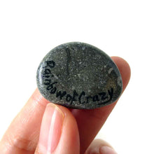 Load image into Gallery viewer, a small beach stone hand painted with a portrait of a guinea pig against a blue background. Available as a keepsake stone or pendant necklace
