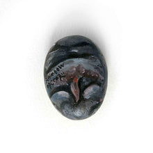 Load image into Gallery viewer, a small beach stone painted to looke like a smiling baby hippo. the underside features the hippo's bottom and is signed with, RainbowofCrazy

