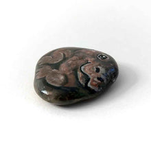 Load image into Gallery viewer, a smooth, flat, beach stone hand painted with a smiling hippo
