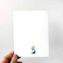 Load image into Gallery viewer, the back of a hungry bunny greeting card, the logo not quite centered

