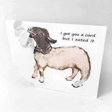 Load image into Gallery viewer, a funny greeting card with a black and white sheep on the front, with the bottom left corner of the card ripped and hanging from its mouth. the card reads, "I got you a card and I eated it"
