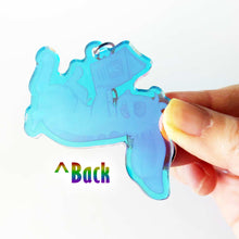 Load image into Gallery viewer, The back of the rabbit acrylic keychain, showing the clear, blue tinted acrylic.
