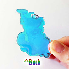 Load image into Gallery viewer, back of the cat acrylic keychain, showing the blue tint and clear acrylic.
