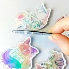 Load image into Gallery viewer, hand holding a magnet to show the thickness: about 2 mm acrylic, plus 1 mm rubber magnet backing.
