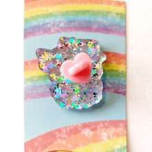 Load image into Gallery viewer, back of a cat acrylic glittery pin, with a heart shaped clutch
