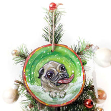 Load image into Gallery viewer, a wood ornament, hand painted with a pug in the snow, tongue out, ready to catch snowflakes
