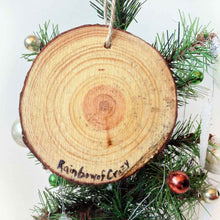 Load image into Gallery viewer, a wood ornament, hand painted with a pug in the snow, tongue out, ready to catch snowflakes. signed on the  back with, rainbowofcrazy

