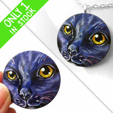 Load image into Gallery viewer, A wood disc painted with the portrait of a cat in dark purple and black, available as a keepsake, fridge magnet, or pendant necklace
