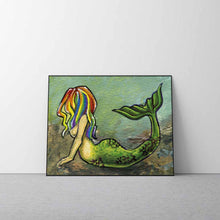 Load image into Gallery viewer, A colorful artwork of a mermaid with bright rainbow hair lying on the ocean floor, arching her back, and raising her tail.
