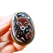 Load image into Gallery viewer, a small beach stone, hand painted with a portrait of a sleeping red fox, available as a keepsake, magnet, or necklace
