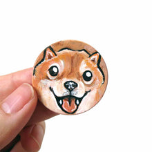 Load image into Gallery viewer, small wood disc painted with a smiling Shiba inu's face. available as a keepsake or pendant necklace 

