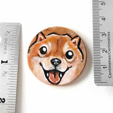 Load image into Gallery viewer, small wood disc painted with a smiling Shiba inu's face. available as a keepsake or pendant necklace 
