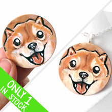 Load image into Gallery viewer, small wood disc painted with a smiling Shiba inu's face. available as a keepsake or pendant necklace 
