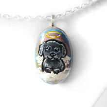 Load image into Gallery viewer, A small beach stone, hand painted with a portrait of a black shih tzu dog as an angel sitting in the clouds. Available as a keepsake, fridge magnet, or necklace
