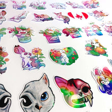 Load image into Gallery viewer, Colourful cartoon cat and rabbit stickers, featuring illustrated animals, flowers, and skulls.
