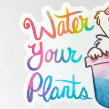 Load image into Gallery viewer, close-up of a sticker featuring an english spot rabbit (from Rainbow of Crazy Comics) in a plant pot. a seedling sits on top of the rabbit's head. the sticker has the words "Water Your Plants".
