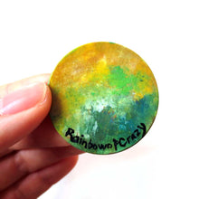 Load image into Gallery viewer, wood pendant hand painted with a bull (taurus) against a starry green background
