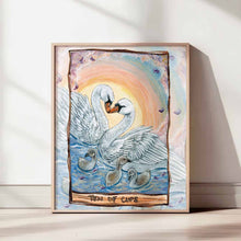 Load image into Gallery viewer, Art print of the Ten of Cups tarot card, featuring a family of mute swans swimming in water with a colorful sky in the background.
