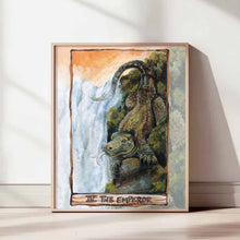 Load image into Gallery viewer, an art print of the emperor tarot card, from the animism tarot: a komodo dragon stands neat the top of a waterfall, looking over the land.
