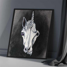 Load image into Gallery viewer, an illustration of a unicorn, split into two sides. the left side features half ot he unicorn's face, while the right side reveals its eerie skull. available as an art print
