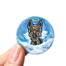 Load image into Gallery viewer, a small wood circle, hand painted with a portrait of an yorkshire terrier dog as an angel in the clouds, with a halo and wings
