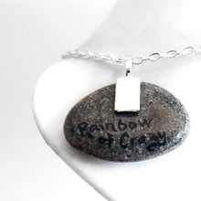 Load image into Gallery viewer, the back of the cancer crab necklace, signed wtih "Rainbow of Crazy"
