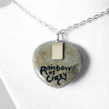 Load image into Gallery viewer, the back of the aries / ram stone pendant necklace, signed with "rainbow of crazy"
