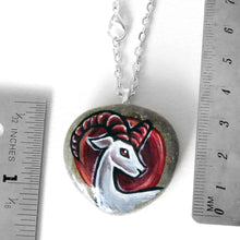 Load image into Gallery viewer, the aries / ram necklace, next to two rulers to show its size: 1 3/8" x 1 3/8" or 3.5 cm x 3.5 cm
