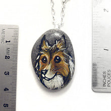 Load image into Gallery viewer, the rough collie portrait stone necklace, next to two rulers to show its size: about 1 1/4" x 1 1/8" or 3.2 cm x 2.8 cm across
